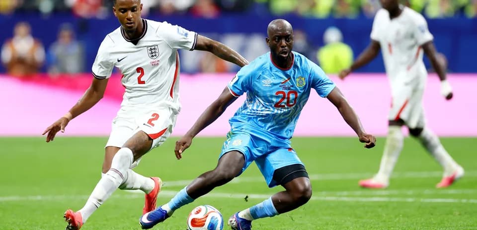 England player tackling Congo DR opponent
