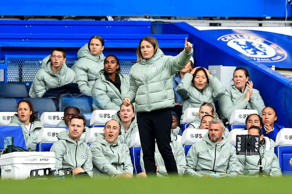Manager directing players from the bench during match