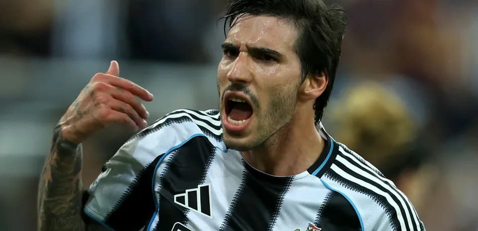 Player celebrating passionately in team jersey