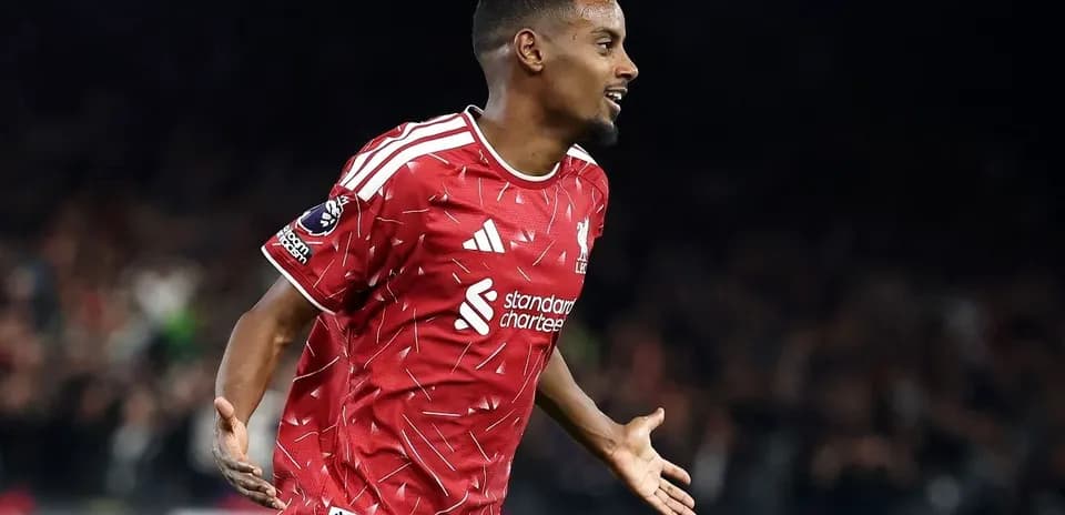 Player celebrating a goal in Liverpool jersey