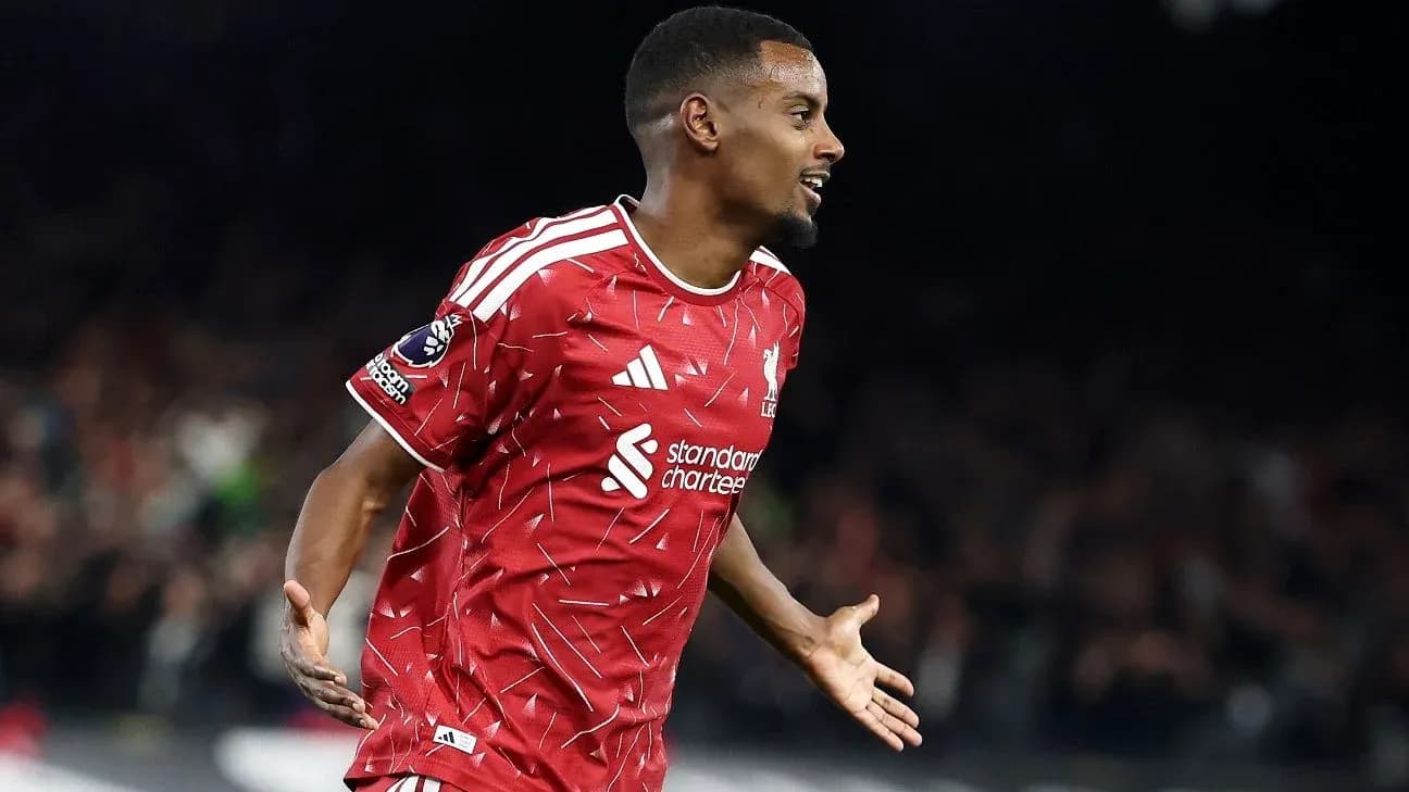 Player celebrating a goal in Liverpool jersey