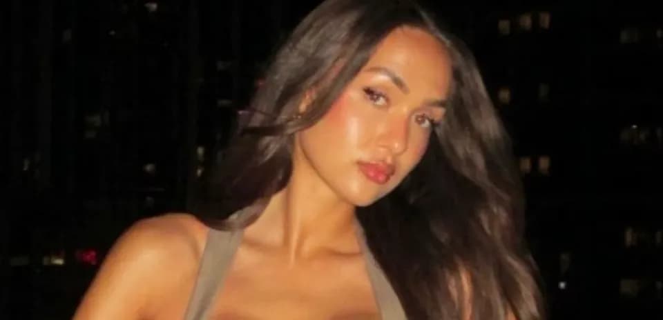 Person posing with long hair in evening setting