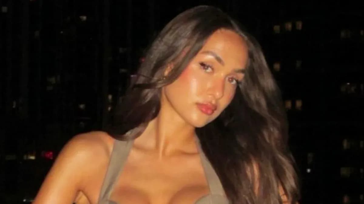 Person posing with long hair in evening setting
