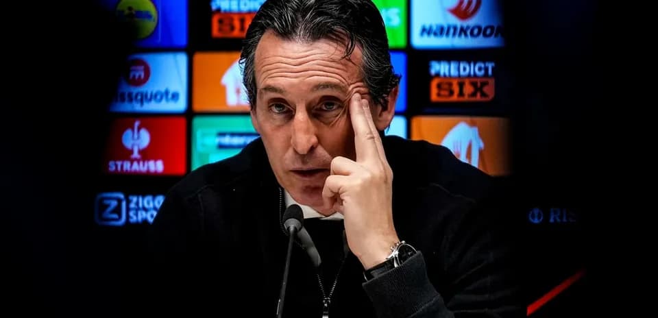 Manager speaking at press conference with logos in background