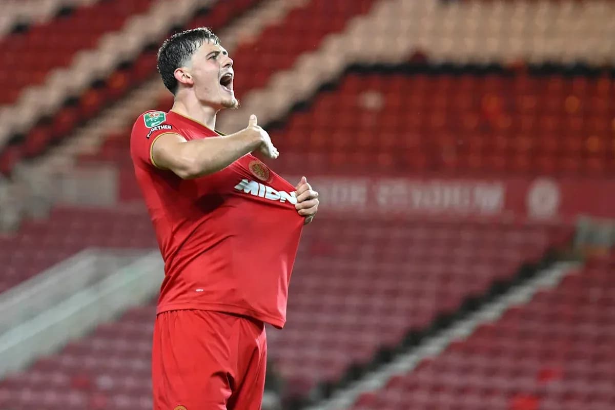 Player celebrating by lifting his shirt after scoring