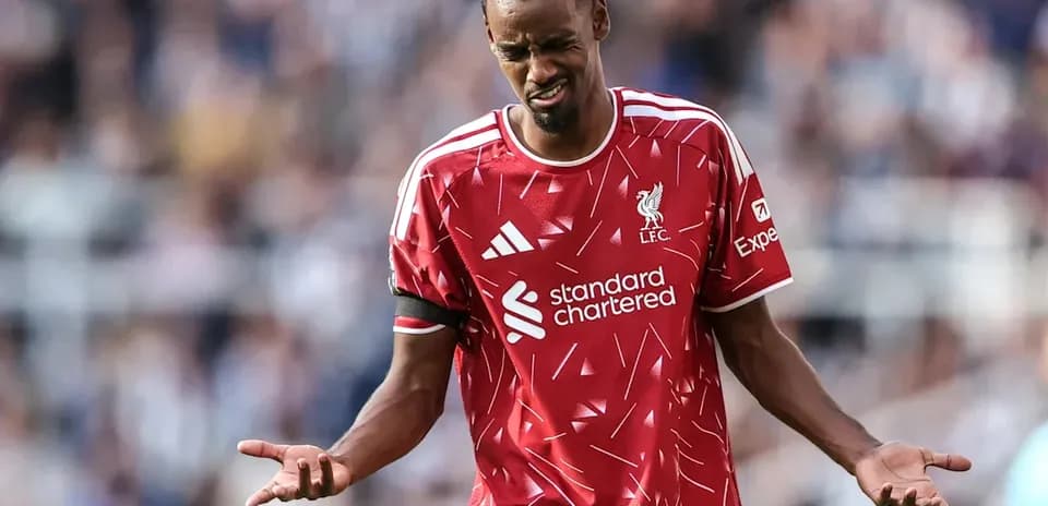 Player in Liverpool kit reacting on the pitch