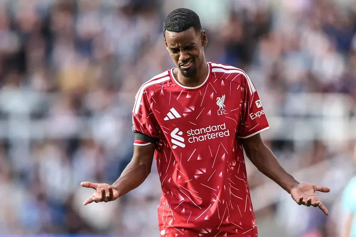 Player in Liverpool kit reacting on the pitch
