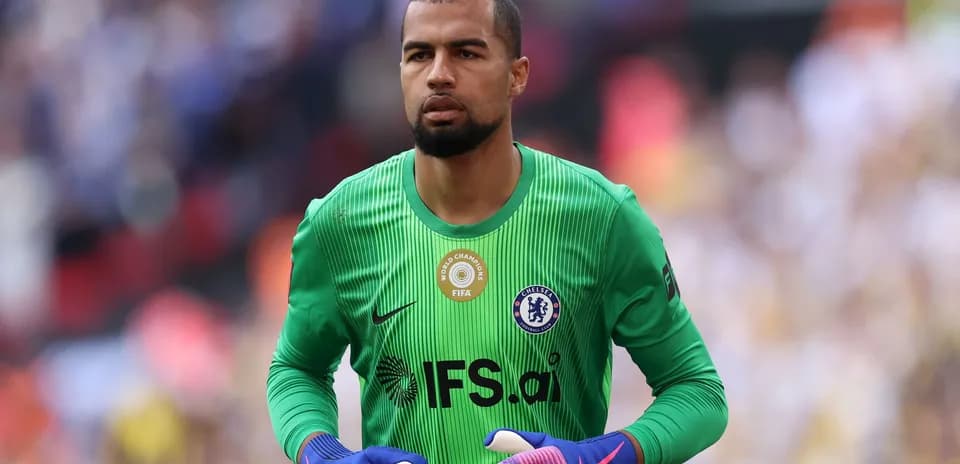 Goalkeeper in green jersey preparing for match