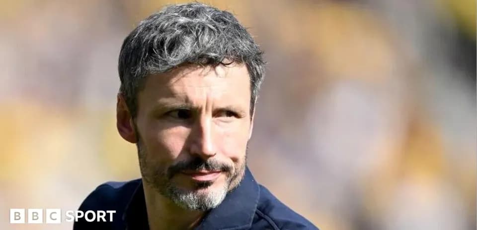 Coach observing players during warm-up session