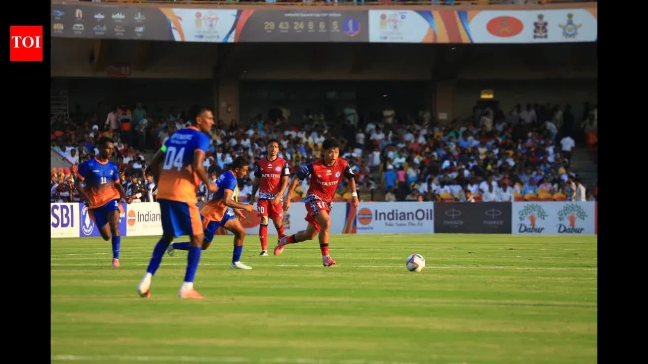 Players competing for the ball during football match