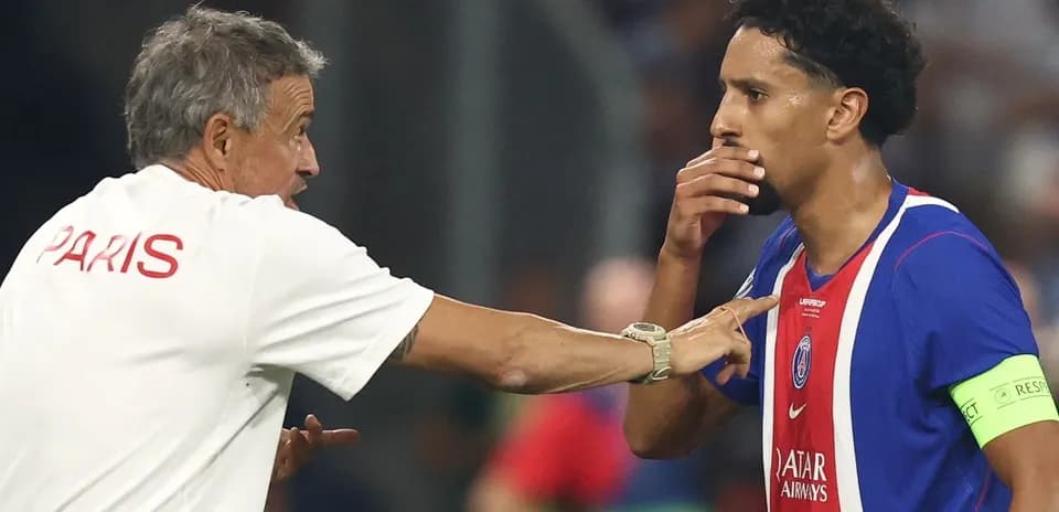 Coach discussing strategy with player during match