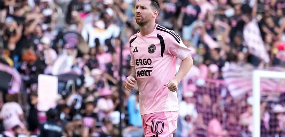 Lionel Messi running on the field during match