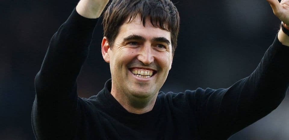 Coach waving to fans after match celebration