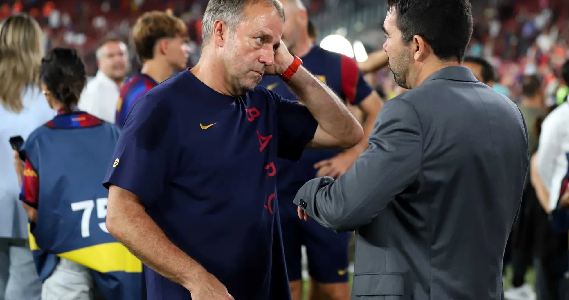 Coaches discussing after a match at stadium