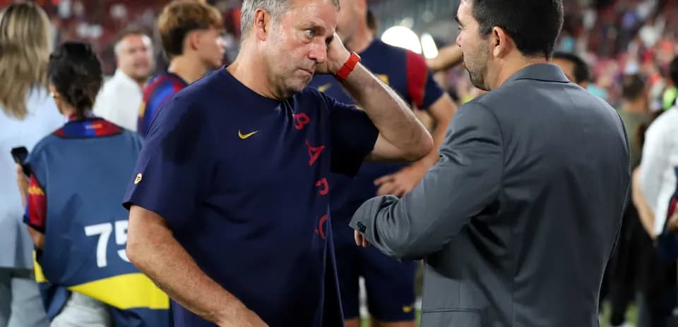Coaches discussing after a match at stadium