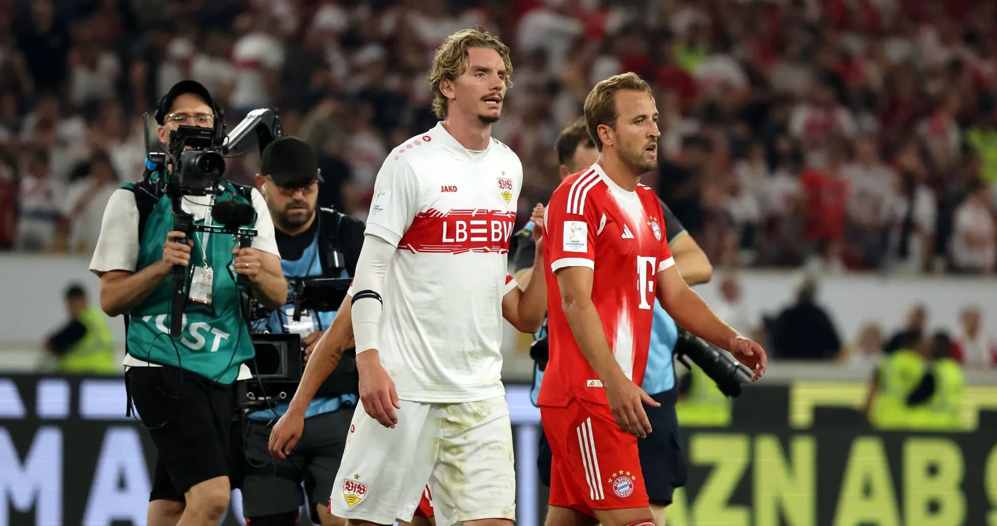 Players from Stuttgart and Bayern walking off the pitch