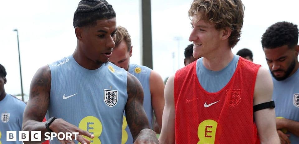 Two players talking during England training session