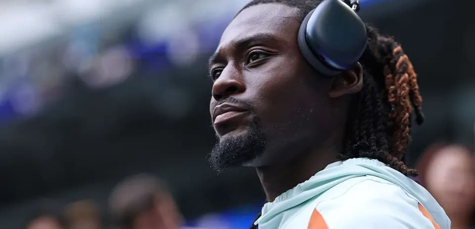 Player wearing headphones before the match