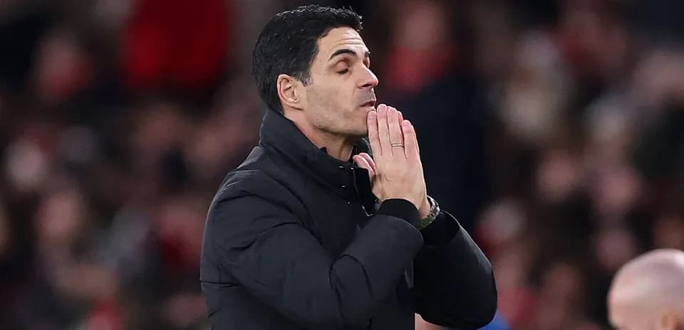 Manager gesturing with hands during match
