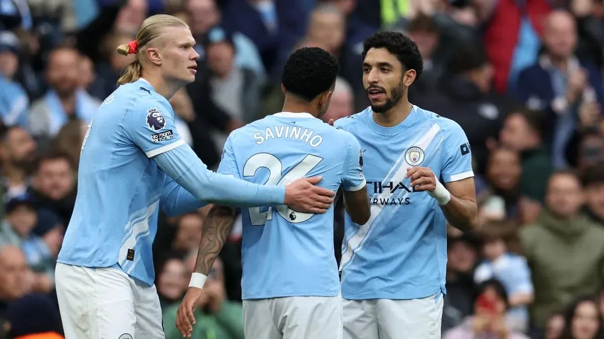 Manchester City players celebrating a goal together