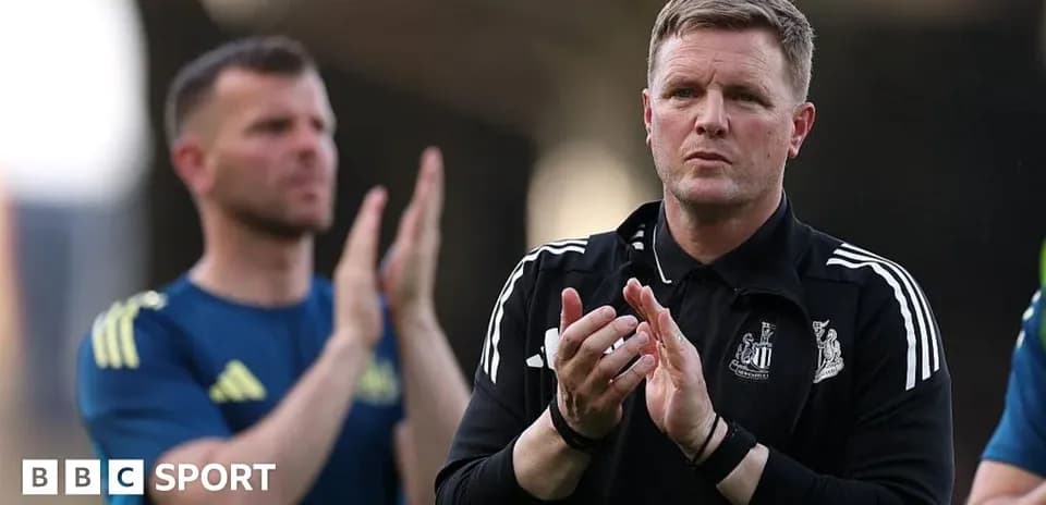 Coach clapping during match with players behind
