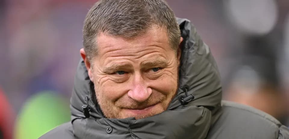 Coach wearing a jacket on the sidelines