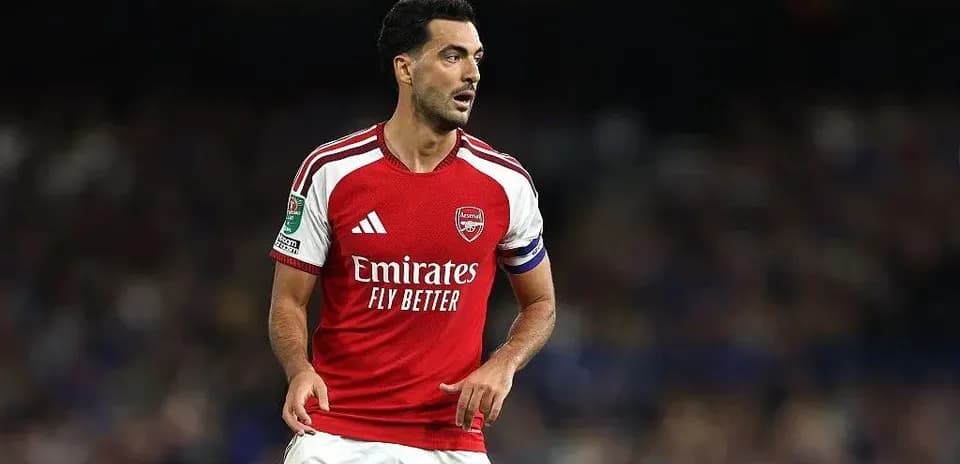 Arsenal player in red jersey during match