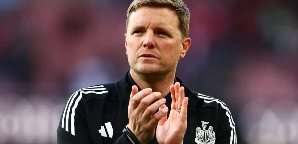 Manager clapping during match on the sidelines
