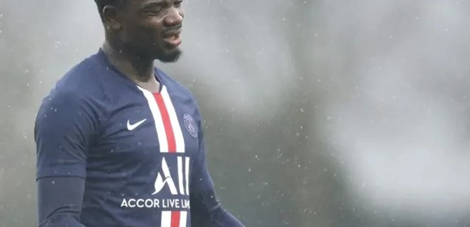 Player gesturing during rainy training session