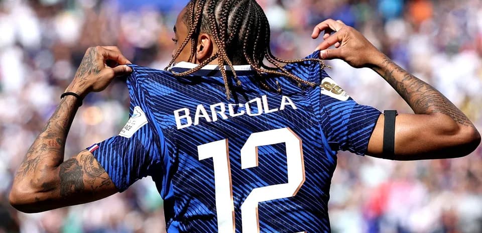 Player showing jersey with name Barcola and number 12