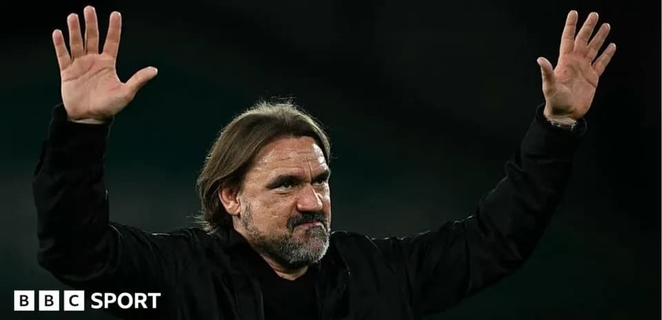 Manager gesturing with hands during match