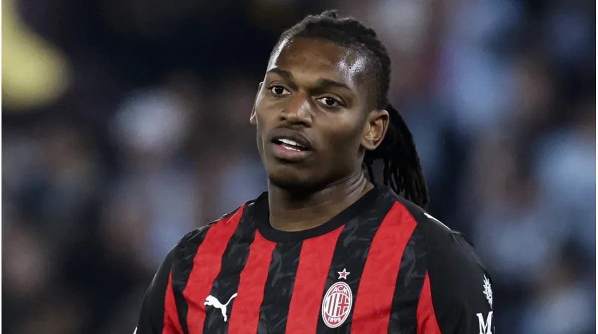 Player wearing AC Milan jersey on field