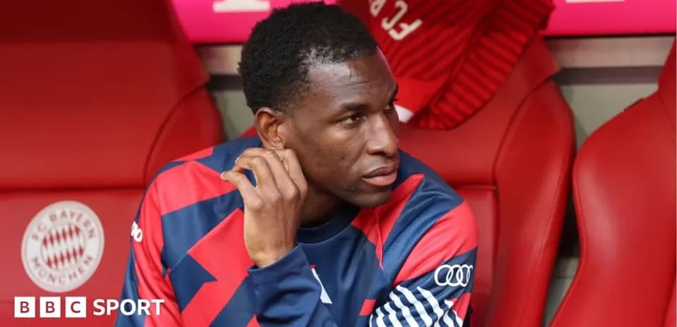 Player sitting on bench during match at stadium