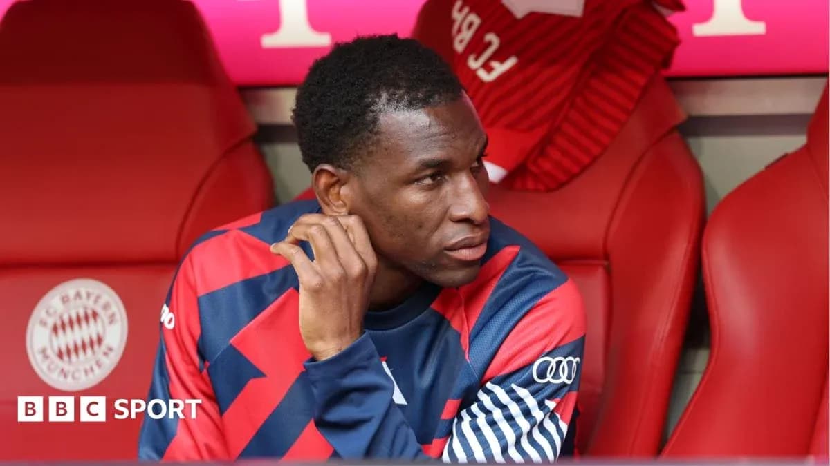 Player sitting on bench during match at stadium