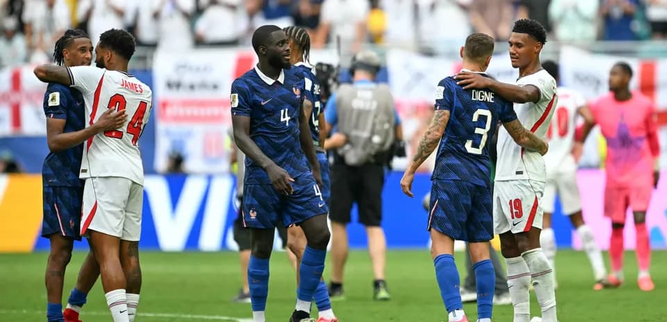 Players from France and England embracing after match