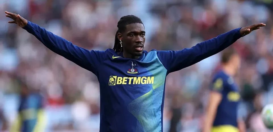 Player gesturing during warm-up on the pitch