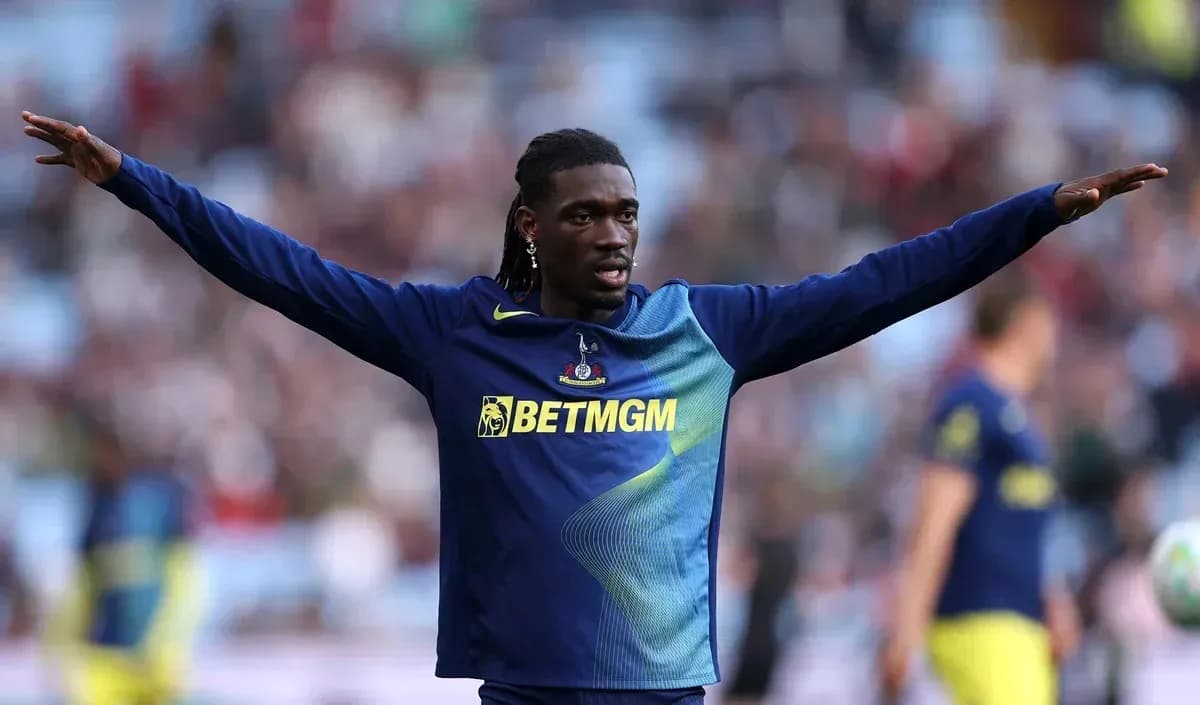 Player gesturing during warm-up on the pitch