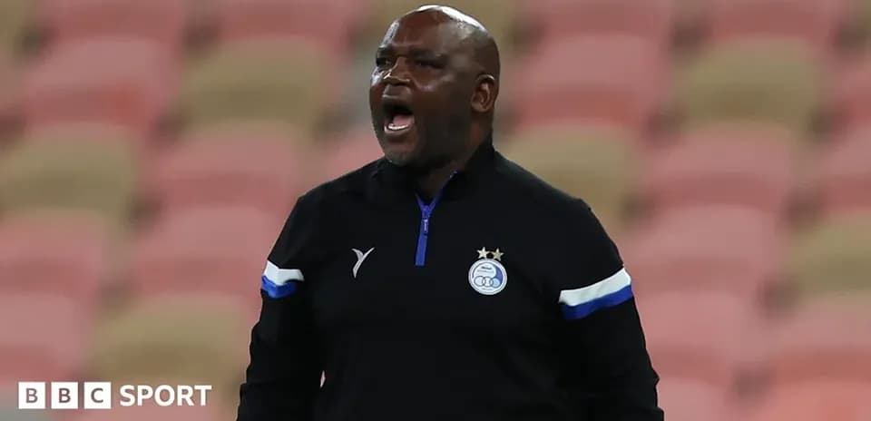 Coach shouting on the sidelines during match