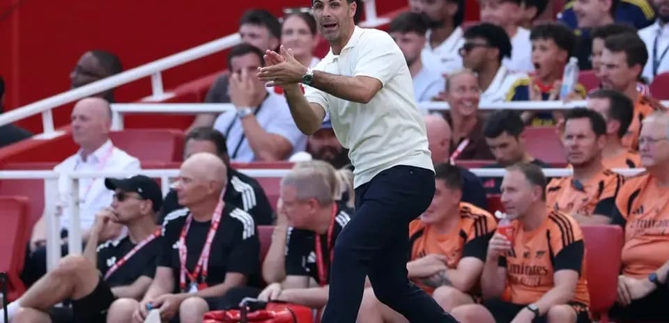 Coach giving instructions from the sidelines during match