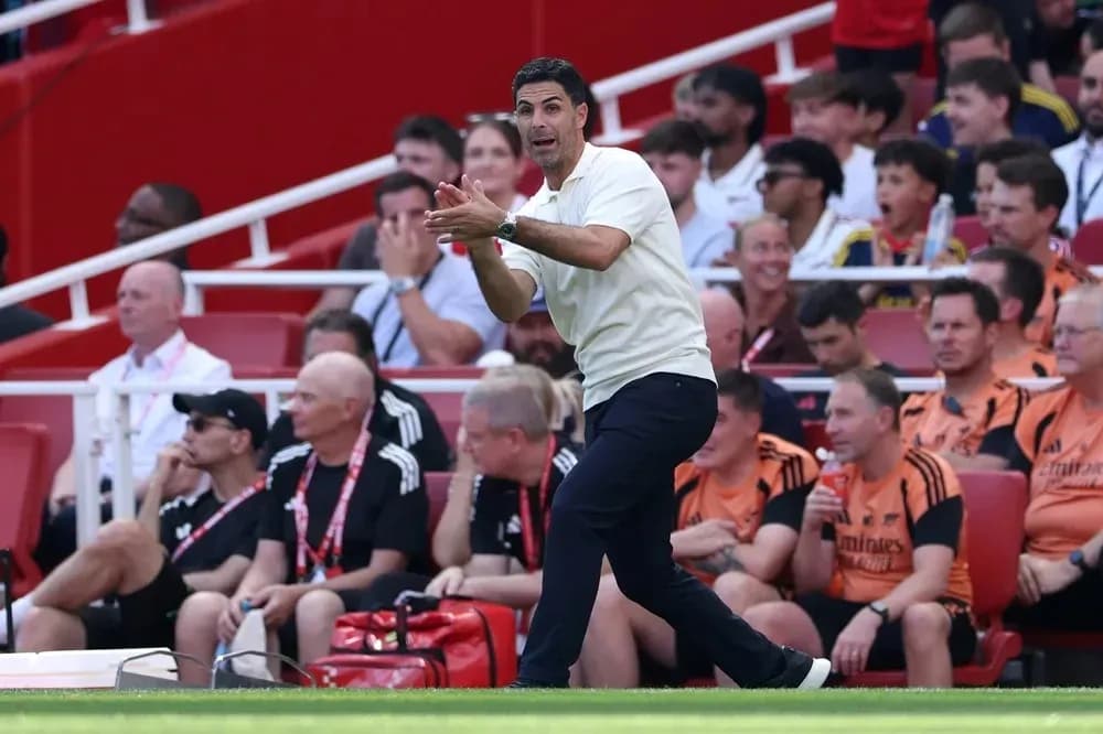 Coach giving instructions from the sidelines during match