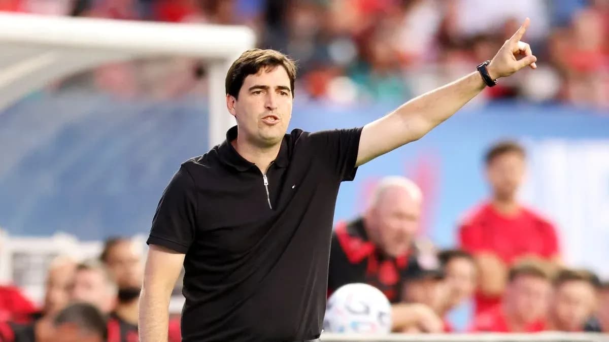 Coach giving instructions from the sidelines during match