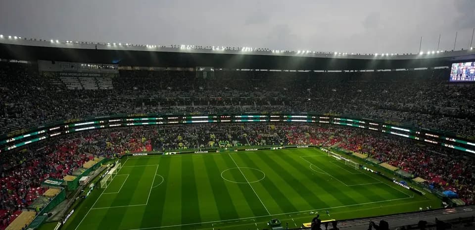 Empty stadium with fans waiting for match to start