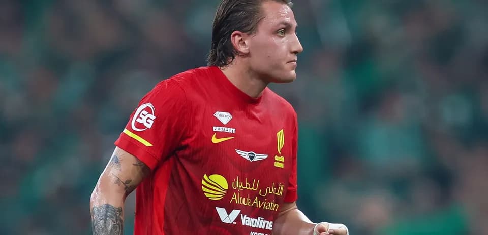 Player in red jersey during football match