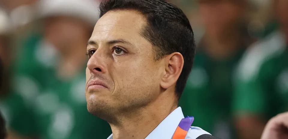 Man with tearful expression in crowd at event
