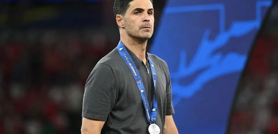 Coach wearing a silver medal after match