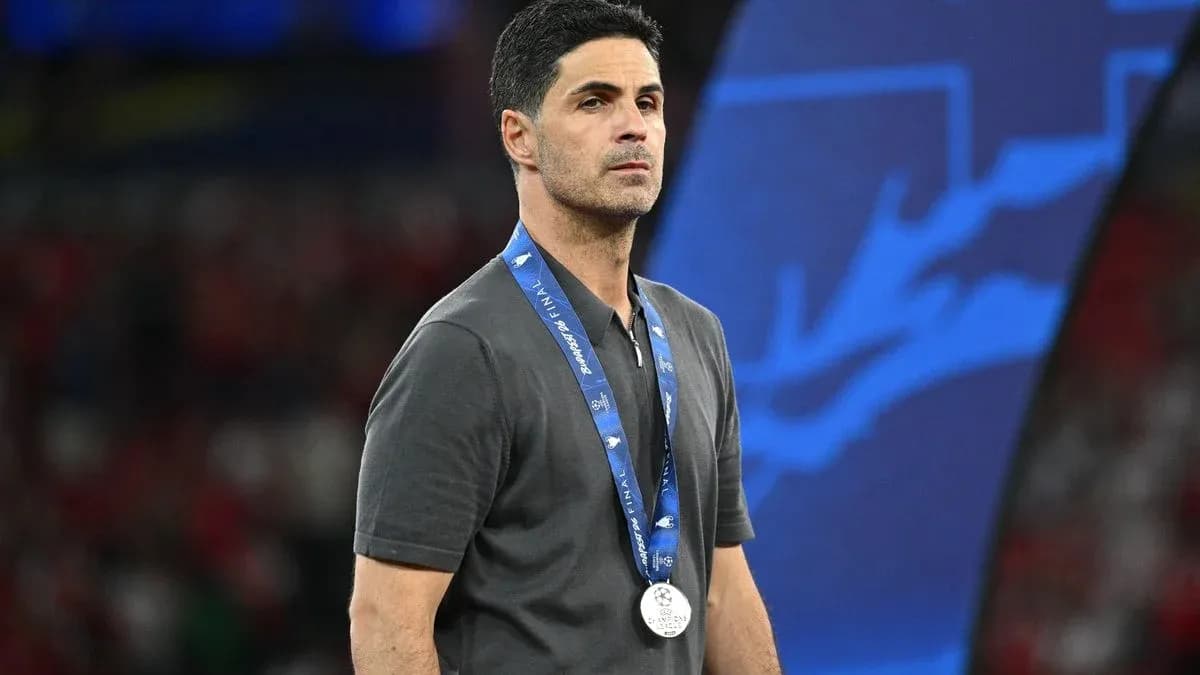 Coach wearing a silver medal after match