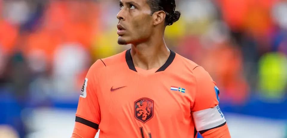 Player in orange jersey looking up during match