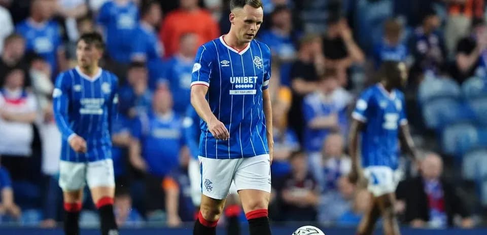 Rangers player walking on pitch during match