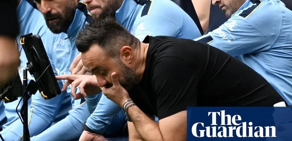 Coaching staff watching match from the sidelines