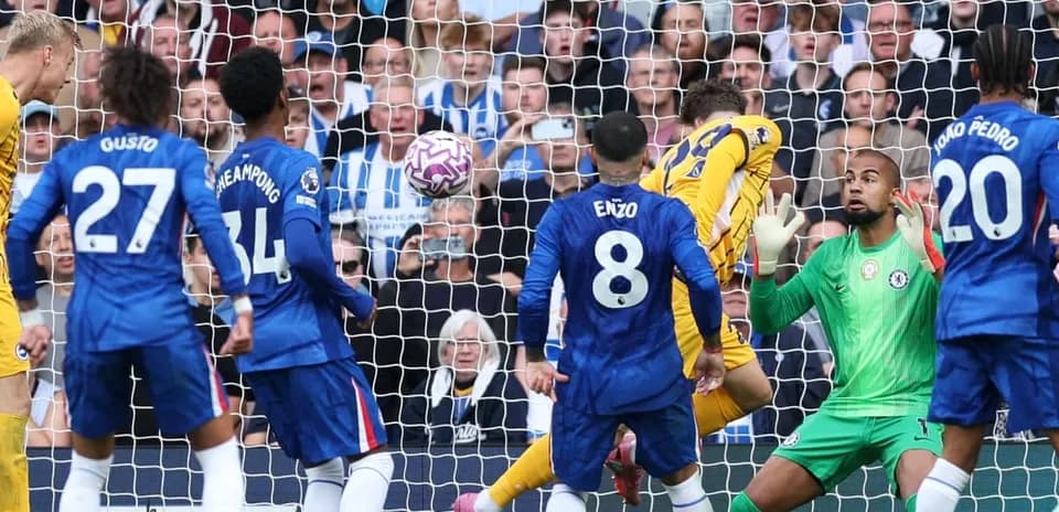Brighton player scoring against Chelsea during match